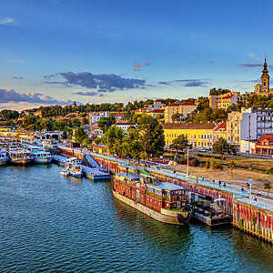 Sunset over Belgrade and ships in the harbor. HDR image