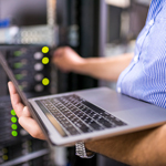 Close-up of the laptop of an IT engineer working in the server room. 